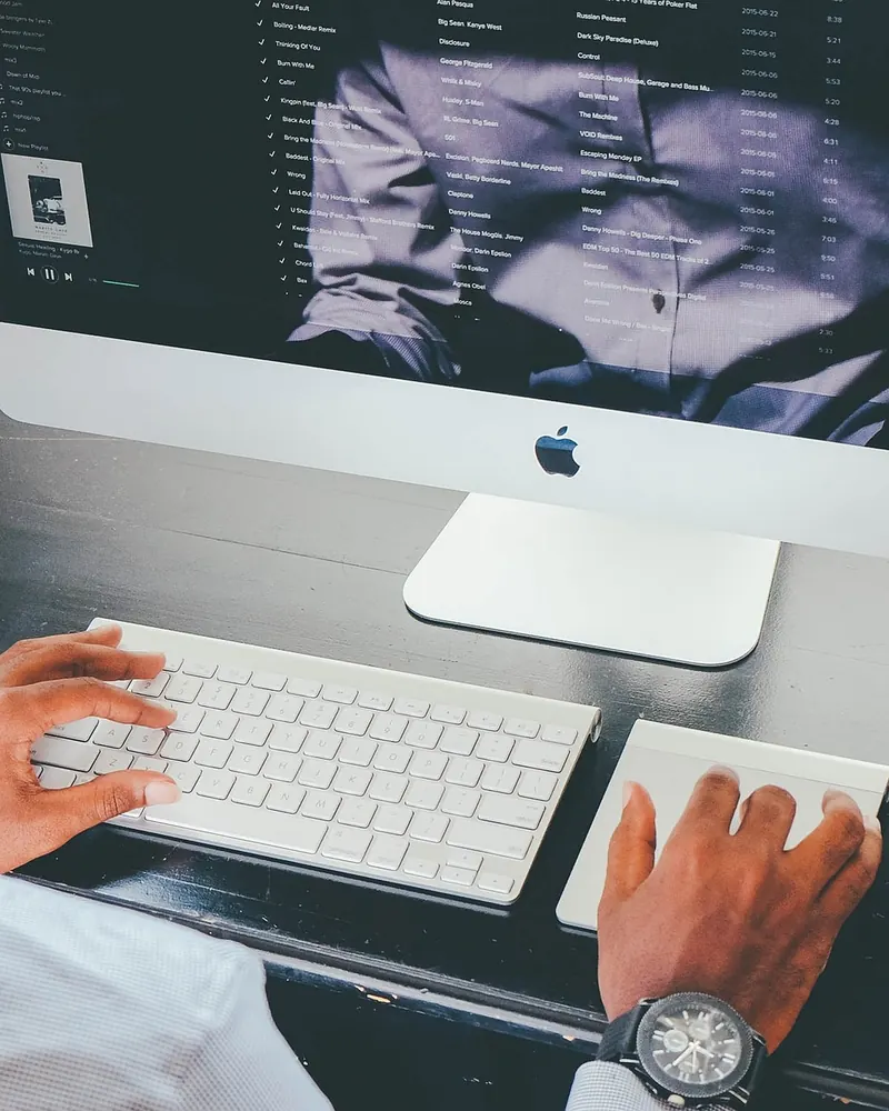 Person working on a desktop computer